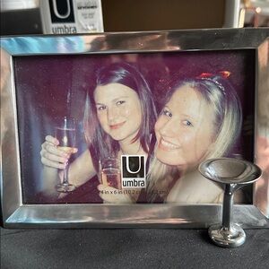 Chrome tabletop picture frame NIB w/ martini glass decor.  Holds 4”x6” picture